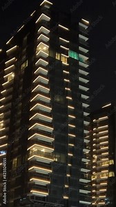 night skyscrapers in Ho Chi Minh City, a new district, a beautiful place, the latest technology, glowing windows against the backdrop of a black sky