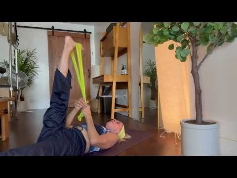 Hamstring stretch with thera-band. Easy to do at home exercise.