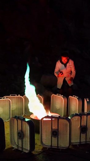 Igniting a Rainbow Fire Tornado | SlowMo Guys