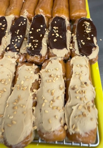 Crafted with pride. Frosted with flavor. Our peanut butter frosting is one of a kind! 🥜 #fyp #food #Donuts #peanutbutter #delicious