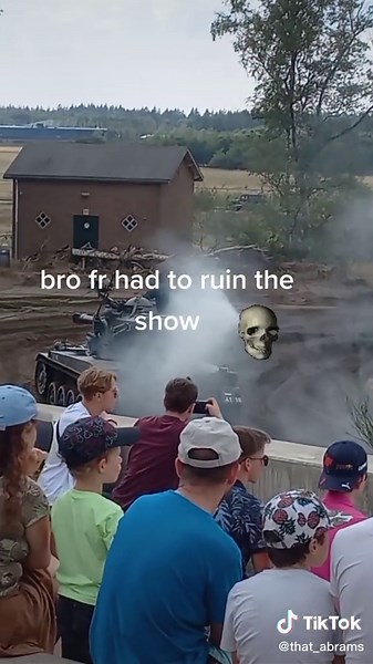 Military Tank Demonstration: Spectators Observe Exciting Display