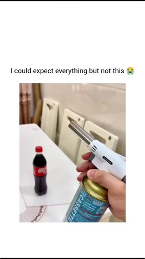 VIRAL VENTURE 🌎 | Follow @the_untamed_earth ​A person uses a handheld butane torch to heat the bottom of a small plastic bottle of Coca-Cola, causing the... | Instagram