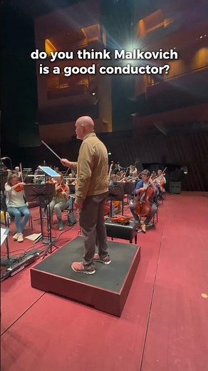 John Malkovich steals Aleksey Igudesman's conducting baton... and starts conducting Ravel's Boléro.