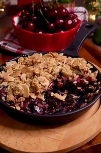 CHERRY ALMOND CRUMBLE #SeasonsFreshWithMeghna - Indulge in the deliciousness of Cherry Almond Crumble with this easy recipe! 🍒🌰 Made with fresh US Northwest Cherries, this sweet treat is perfect for this period of July - August when these delicious cherries are available. Just mix cherries with brown sugar and cornflour, then top with a crumble mixture of oats, sugar, butter, and almond flakes. Bake until golden and serve hot with a scoop of vanilla ice cream for the ultimate dessert experienc