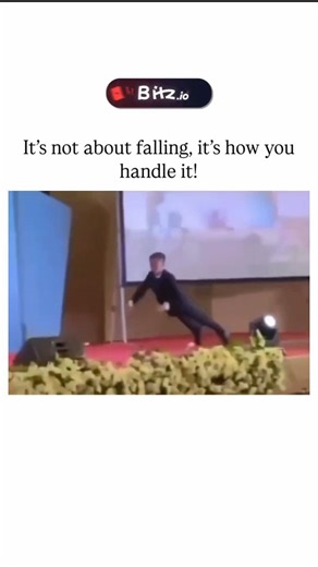 Reelity on Instagram: "The video depicts a suited man stumbling on stage during an award-like event, executing a seamless forward roll to regain footing and continue unfazed, earning audience cheers. , an account curating viral oddities, the clip amassed 116,000 views and 1,300 likes within a day, reflecting viral appeal of improbable poise under pressure. Echoing the pratfall effect from Aronson's 1966 study, the recovery transforms a flaw into charm, as competent mishap-handling boosts likabil