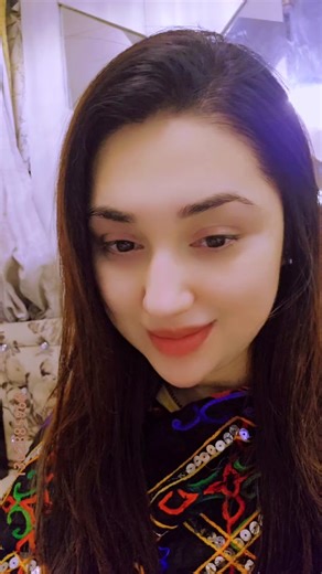 Stunning Embroidered Clothing and Dark Brown Hair