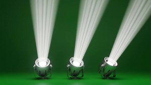 Download Studio moving head spotlights casting bright white beams on green backdrop for free