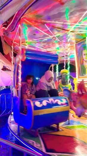 Riding the merry-go-round on a beautiful, colorful night with the family. So much fun 🎡🎢🥳🥰👯‍♀️