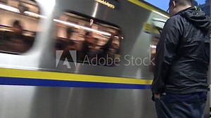 4K Hd Ultra, Train arriving at the train station Taipei. People get on a train. Camera at the floor level filming the traffic in Taiwan-Dan