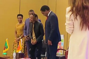 Zambian musician Elton Mulenga, otherwise known as Yo Maps, takes a photo with President Hakainde Hichilema and Minister of Youth, Sport and Arts Elvis Nkandu at Mulungushi International Conference Centre during the Youth Indaba today. | Kalemba