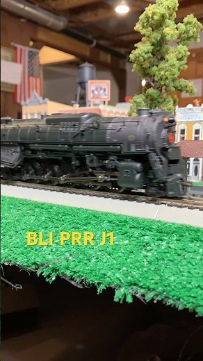 Ho model Pennsylvania Railroad J1 2-10-4 hauling a freight train