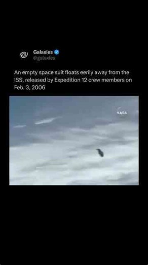 Empty space suit floating away in space