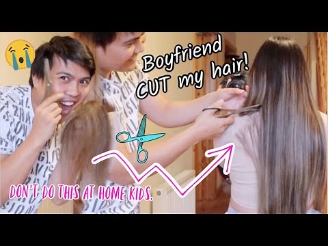 Boyfriend cuts girlfriend's long hair