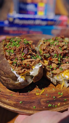 Pulled Pork Loaded Baked Potatoes made easy with the help of Reynolds®. Secret weapons for your next BBQ. | Reynolds Brands