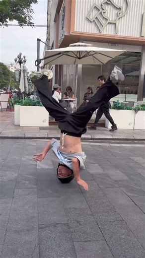 Young man walking with arrogance becomes impressive. Street crowd shocked by bubble tea moment
