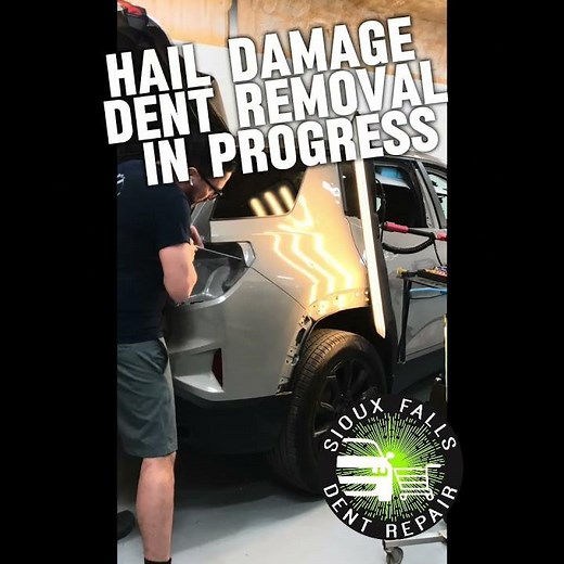 Auto hail damage dent removal in progress using the paintless dent repair method in Sioux Falls, SD