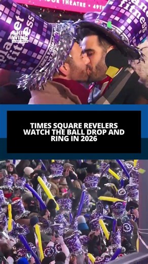 Times Square revelers watch the ball drop and ring in 2026