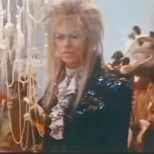 As the World Falls Down” is one of five songs Bowie wrote and recorded for the film, in which he also starred as Jareth, the king of the goblins. A love ballad, “As the World Falls Down” was written for a dream sequence in which Jareth and the film’s heroine, Sarah, dance at a fantastic masquerade ball. Bowie said of the song, “[Director] Jim Henson wanted something which was fairly old-fashioned in its sentiments and it is, for me, the prettiest tune in the movie, and the most relaxed.” The son