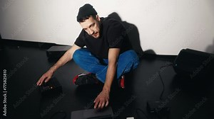 Recording session: Rapper male utilizes laptop and audio devices for recording new music Stock Video