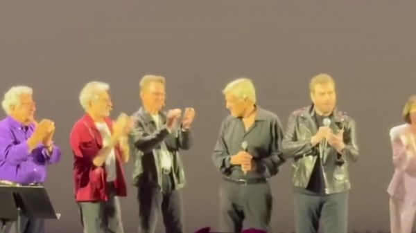 John Travolta dresses as Danny Zuko in surprise Grease performance