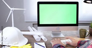 electricity engineer person working on a computer