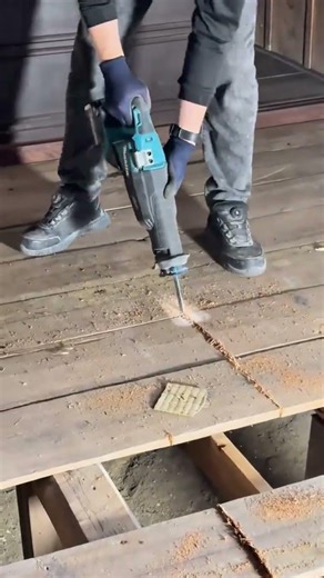 Cutting Wood Planks Using A Reciprocating Saw For Precise And Professional Woodworking