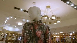 'Riverdale' actress Shannon Purser secures the bag during designer shopping outing