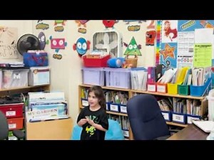 A pre-school teacher debriefs with her class on their use of learning dispositions