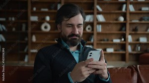 Smiling Caucasian male mature business man businessman worker psychologist cellphone user looking mobile phone using smartphone online app scrolling browsing social media chatting indoors office room