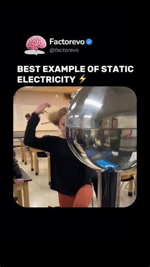 FACTOREVO | FACTS on Instagram: "Static electricity is the buildup of electric charges on the surface of an object — usually caused by rubbing two materials together. The charge remains until it’s discharged, like the small zap you feel when touching a doorknob. In this classroom demo, a Van de Graaff generator transfers charge onto the person’s body, causing their hair to stand up — because like charges repel each other. It’s one of the simplest yet most fascinating ways to visualize invisible 