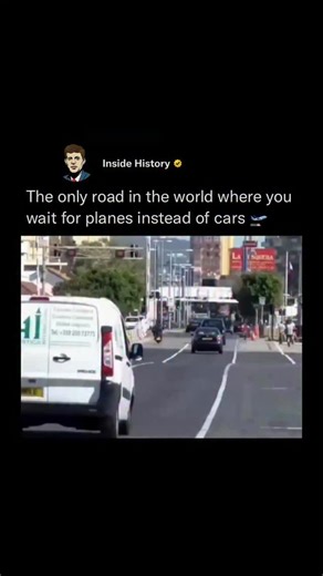 Inside History on Instagram: "Driving in Gibraltar becomes unforgettable once you realize the main road cuts straight across the airport runway, forcing everyday traffic to pause as full-size aircraft line up to land or take off. Gibraltar International Airport relies on barriers and ground crews to stop cars whenever a flight approaches, transforming an ordinary commute into a rare experience where drivers wait just meters from roaring engines, flashing lights, and moving planes. Those who witn