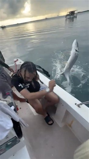 He stretched his arm out of the water holding a little fish 😱