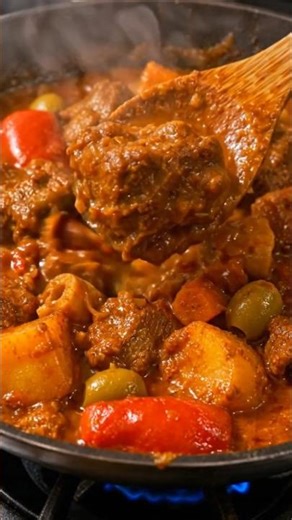 Spicy, rich, and sizzling! 🐐🔥 Try this mouthwatering Goat Caldereta now—tap to watch and crave more!