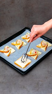 I just found the brilliant trick for making appetizers! Ingredients toast bread: 6 slices parsley: 15 g (0.5 oz) garlic: 20 g (0.7 oz) chili flakes: 2 g (0.1 oz) soft butter: 70 g (2.5 oz) ham: 150 g (5.3 oz) cheese: 100 g (3.5 oz) tomatoes: 1 pc parsley: 15 g (0.5 oz) mayonnaise: 100 g (3.5 oz) Additionally eggs: 1 pc vegetable oil: 20 ml (0.7 fl oz) vinegar: 10 ml (0.3 fl oz) chili sauce: 10 ml (0.3 fl oz) salt: 2 g (0.1 oz) black pepper: 1 g (0.0 oz) | Appetizing.tv