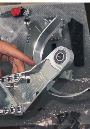 putting together the CRAVE machined billet swingarm for surron light bee. Lots of great features: stronger design, very small stretch for added stability, spare belt holder, sleek belt/primary chain guard, 1 large bearing on each swingarm side for easy maintenance, a jackshaft locking pin, and more. Look out for another video soon discussing these features in more detail. Check it out along with a bunch of other emoto parts on craveparts.com and save with code 999motard5 #fyp #polished #cncmachi