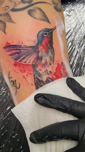Vibrant Watercolor Hummingbird Tattoo Creation