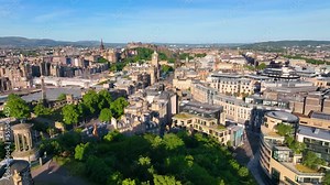 New Town aerial view on Princes Street and Balmoral House with Edinburgh Castle at the background in Edinburgh, Scotland, UK. New Town Edinburgh is a UNESCO World Heritage Site since 1995.