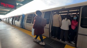 Frustrated commuters struggle to board crowded BART trains after power issue causes delays