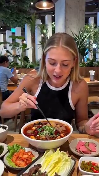 Seedance 2.0 is pretty wildThis person doesn't exist🤯Try this prompt👇PROMPT: Generate a short video for product promotion. A woman (@ Image1), sitting at a restaurant table, eating Mala Tang (@ Image2), explaining the taste of the product. Use colloquial language and a casual, conversational tone to share her experience. Simultaneously, she uses chopsticks to pick up and showcase special ingredients from the Mala Tang (such as bursting cheese balls/tender beef). Her expression is friendly and 