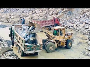 Big CAT Loader in Action – Rock Loading and Hauling at Construction Site"