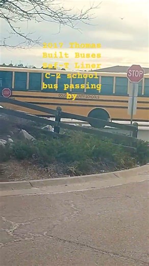 2017 Thomas Built Buses Saf-T Liner C-2 school bus passing by