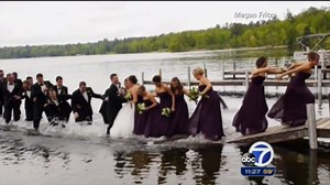 Wedding party falls into lake after dock collapses