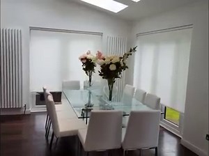 Motorised roller blinds recently installed. The white textured fabric really compliments this beautiful home. | Shutters & Blinds UK