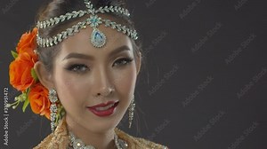Portrait of an Indian bride with traditional makeup and jewelry on her wedding day - close up static poses