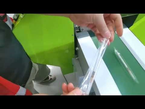 Syringes feeding flow wrap packaging equipment