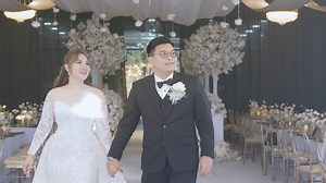 A timeless celebration of elegance in its purest form. This all-white wedding reception was designed to feel soft, romantic, and refined-from the moment guests stepped in. Layers of flowing fabric and delicate tulle draped across the ceiling, creating a gentle canopy that softened the space and added depth without overpowering it. Warm lights and classic floral arrangements completed the look, allowing simplicity and texture to take center stage. An atmosphere that feels light, graceful, and eff