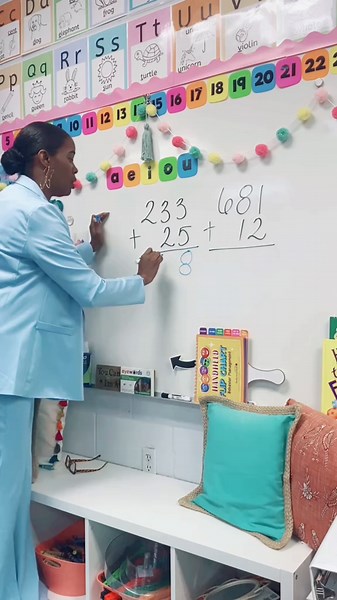 Adding triple and double digit numbers in first grade just got a whole lot easier! Create a fun and catchy jingle and hello to math confidence! #regrouping #math #firstgrade #teachingtips #teachercoach #instructionalcoach #academiccoach #firstgradeteacher #elementaryteacher #classroomoftheelite #tiktokteacher #blackeducators #blackteachersontiktok #blackgirlmagic
