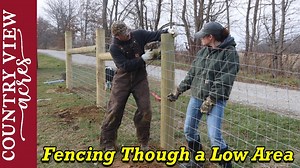 Stretching Livestock Fence Through a Low Area. Our Amazon Affiliate Store with Fencing Tools used in this Video. http://amazon.com/shop/countryviewacres | Country View Acres