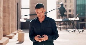 City, phone and man walking while typing message, email or post on internet with smile outside. Technology, 5g communication and networking, businessman online reading happy text or social media meme