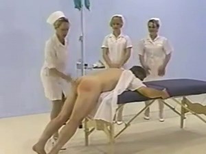 Nurse giving male enema